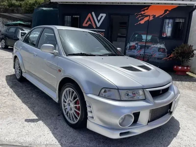 Cinza Usado 1999 Mitsubishi Lancer Sedan | € 75.000 - Imagem 1/4