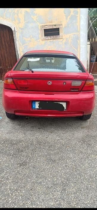 Usado 1994 Mazda 323F Sedan | € 1.500 - Imagem 1/4