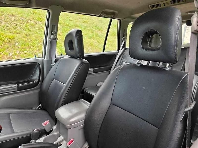 Usado Suzuki Grand Vitara 109 HP (80 kW) 2005 Cinzento Citadino