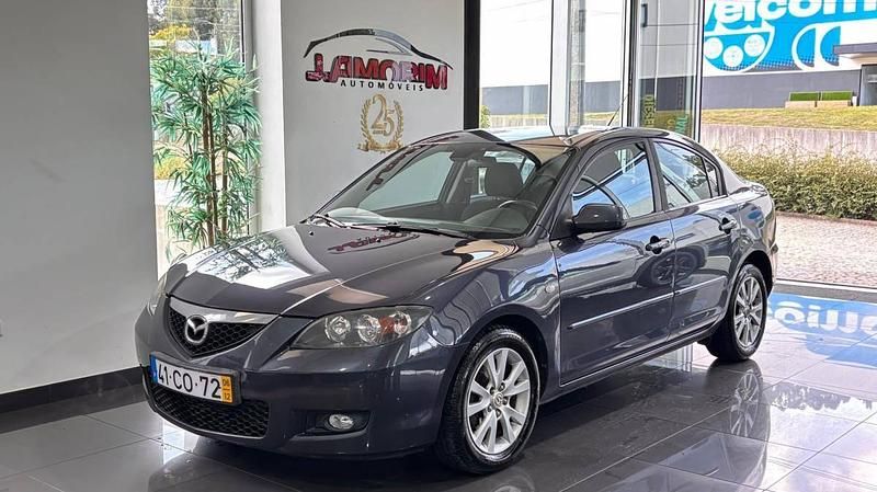 Cinza Usado 2006 Mazda 3 Exclusive Sedan | € 4.499 (Preço justo) - Imagem 1/4