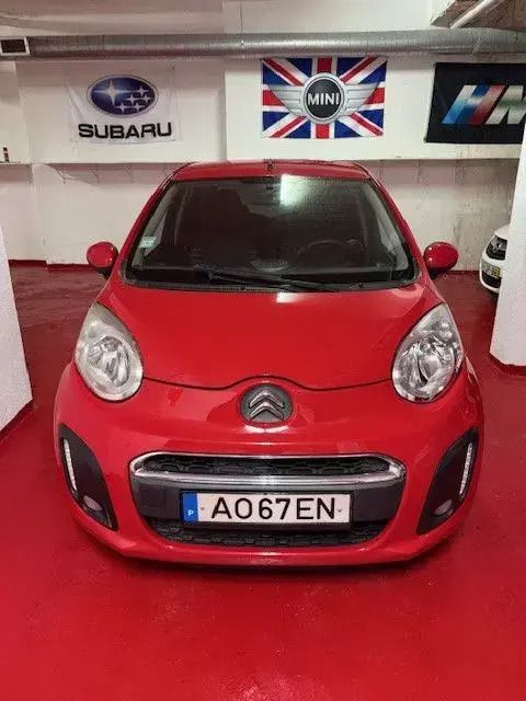 Vermelho Usado 2012 Citroën C1 Seduction Citadino | € 5.500 - Imagem 1/4