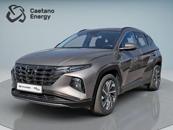 Silky bronze (metalizado) Usado 2023 Hyundai Tucson Premium SUV | € 28.300 (Preço justo) - Imagem 1/4