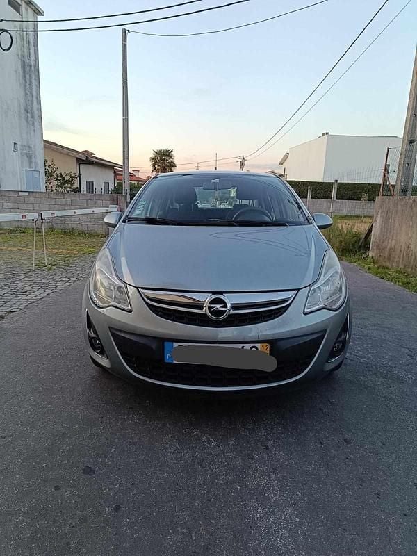 Cinzento Usado 2012 Opel Corsa Citadino | € 3.800 - Imagem 1/4
