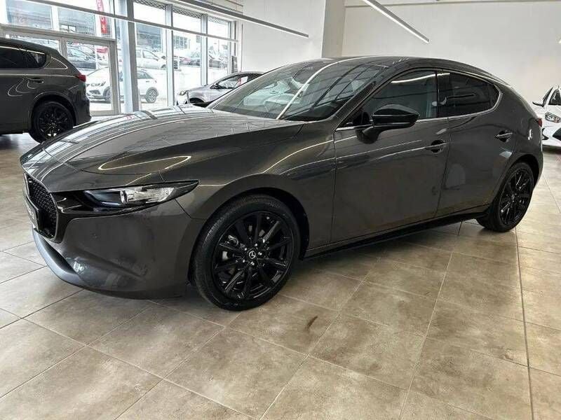 Cinzento Usado 2024 Mazda 3 Homura-Line Citadino | € 30.999 - Imagem 1/4