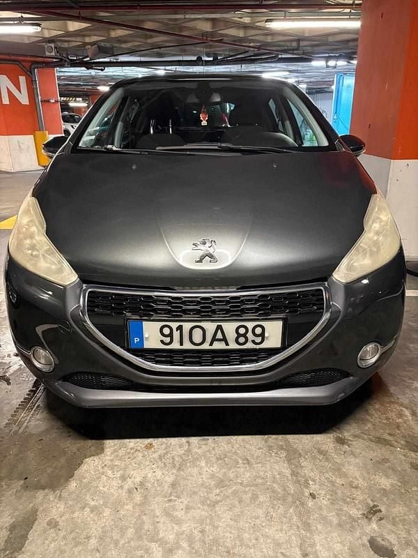 Usado Peugeot 208 68 HP (50 kW) 2013 Cinzento Citadino