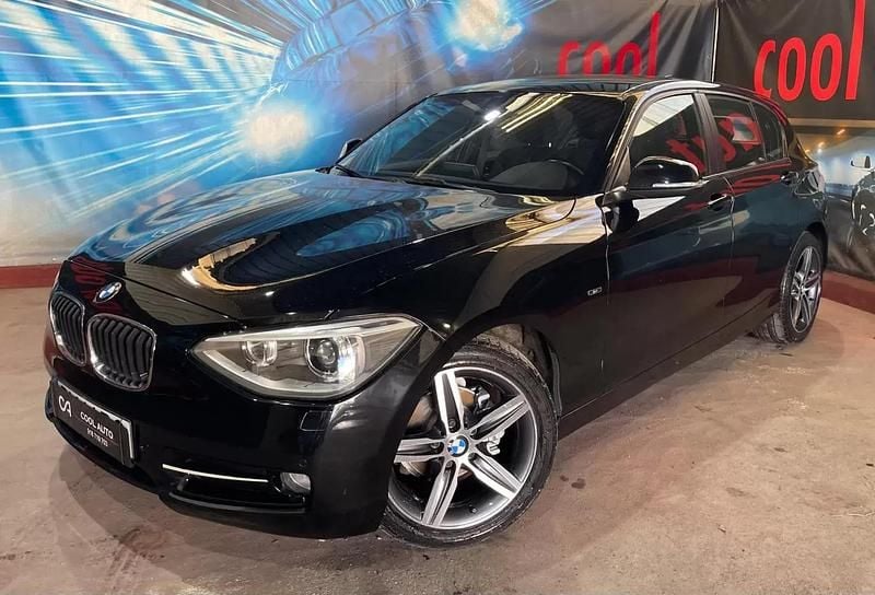 Preto Usado 2015 BMW 118 Sport Line Citadino | € 13.999 (Preço justo) - Imagem 1/4