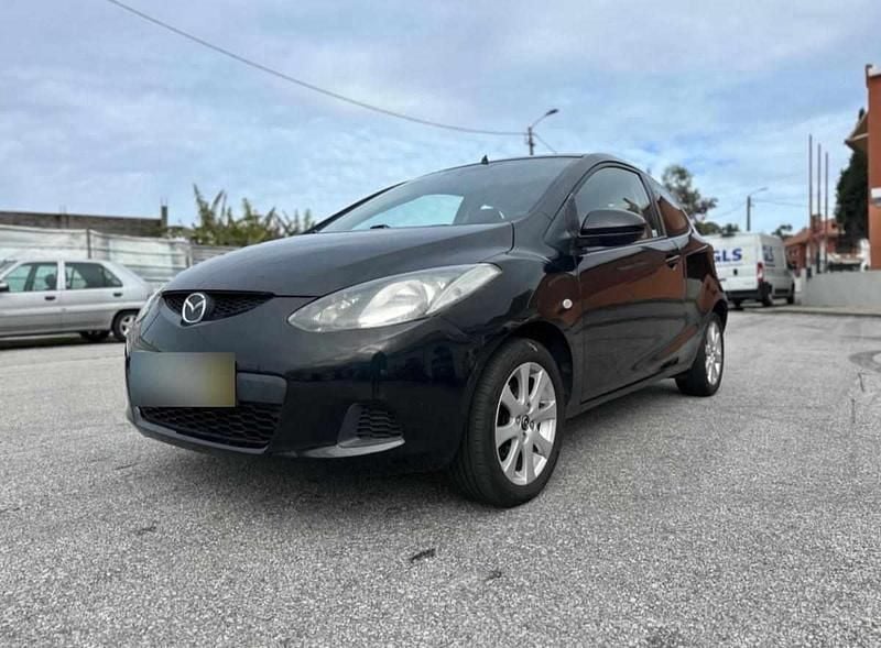 Preto Usado 2011 Mazda 2 Citadino | € 3.200 - Imagem 1/4