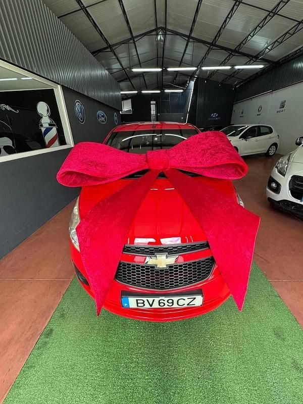Vermelho Usado 2012 Chevrolet Spark Citadino | € 6.000 - Imagem 1/4