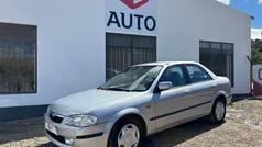 Cinza Usado 2000 Mazda 323F Sedan | € 2.900