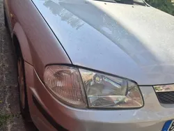 Cinzento Usado 1999 Mazda 323 Sedan | € 1.800