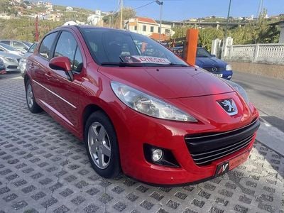 Usado Peugeot 207 68 HP (50 kW) 2010 Vermelho Citadino