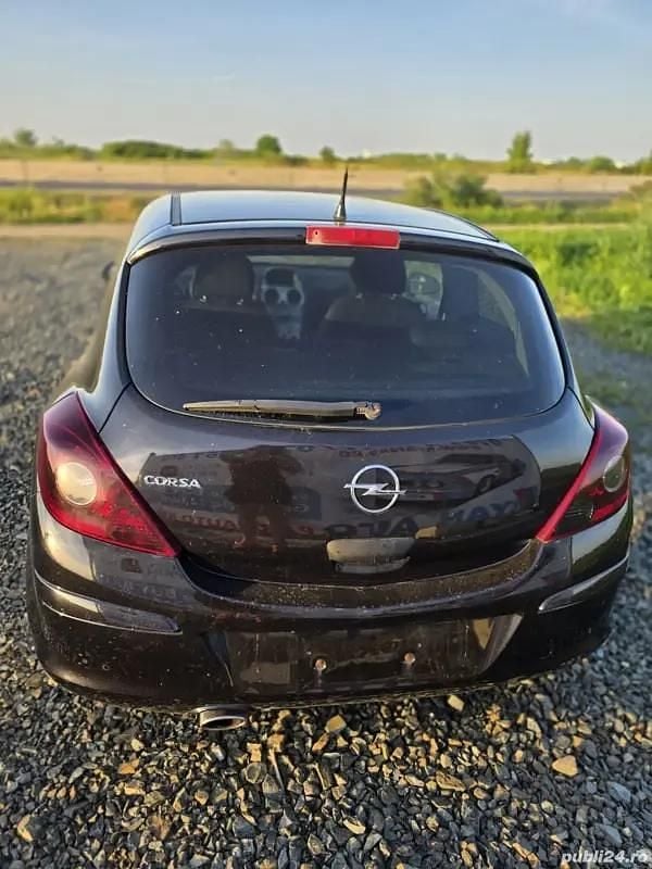 Second-hand Opel Corsa 101 CP (74 kW) 2010 Negru Hatchback