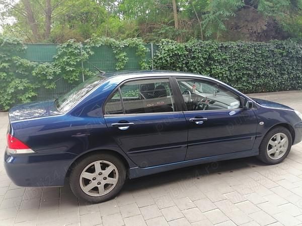 Second-hand Mitsubishi Lancer 98 CP (72 kW) 2009 Albastru Berlinǎ