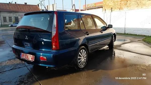 Second-hand Mitsubishi Lancer Invite 98 CP (72 kW) 2005 Negru Berlinǎ