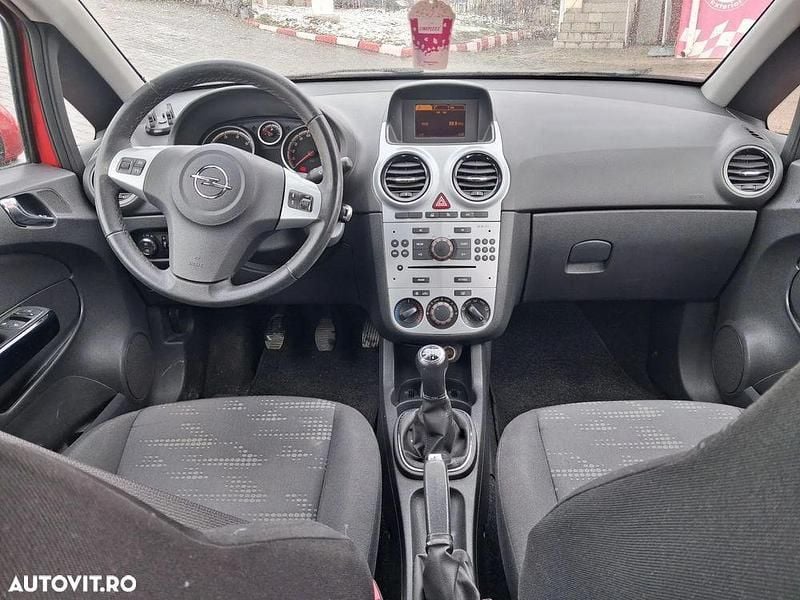 Second-hand Opel Corsa Cosmo 95 CP (69 kW) 2012 Culoarerosu Hatchback