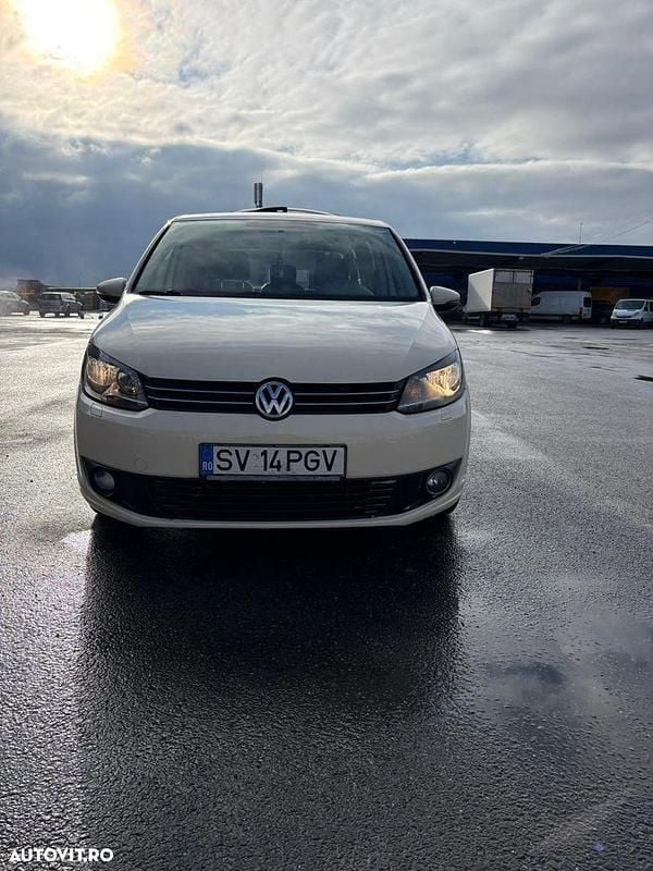 Second-hand VW Touran 115 CP (84 kW) 2014 Culoaregalbeuriu Monovolum