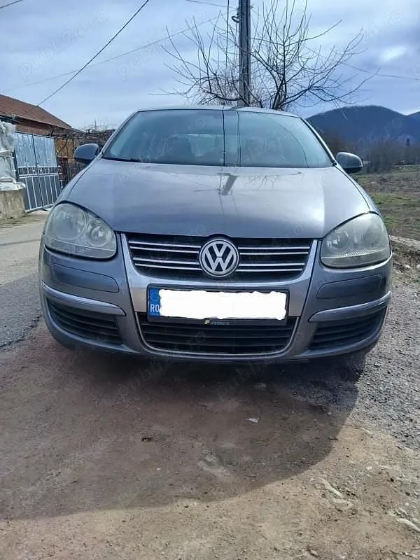 Second-hand VW Jetta 105 CP (77 kW) 2009 Gri Berlinǎ