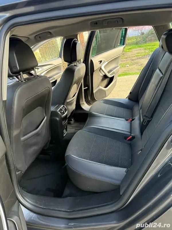 Second-hand Opel Insignia 160 CP (117 kW) 2011 Gri Break