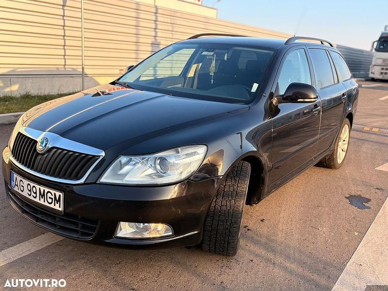 Culoarenegru Utilizat 2012 Skoda Octavia Elegance Break | 6.599 EUR (Preț OK) - Imagine 1/4
