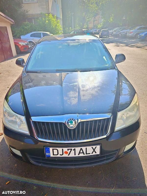 Culoarenegru Utilizat 2011 Skoda Octavia Ambiente Cabrio | 4.500 EUR - Imagine 1/4