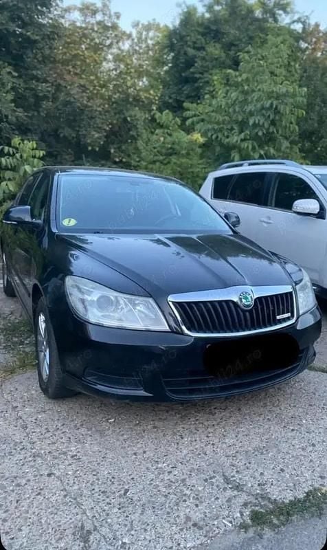 Negru Second-hand 2011 Skoda Octavia GreenLine Berlinǎ | 3.800 EUR (Preț OK) - Imagine 1/2