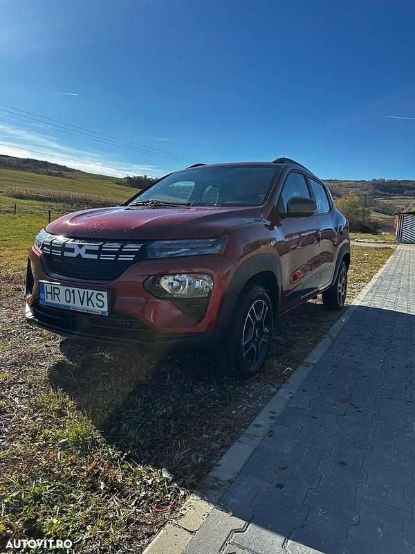 Culoarerosu Utilizat 2023 Dacia Spring Hatchback | 9.600 EUR (Preț OK) - Imagine 1/4
