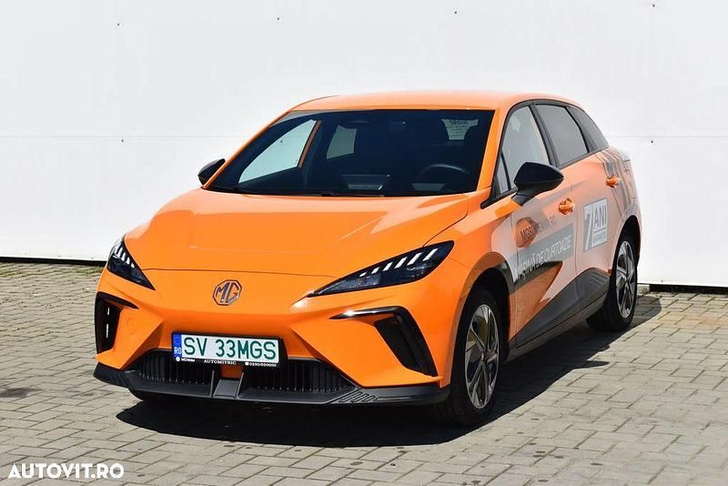 Portocaliu Utilizat 2024 MG MG4 EV Exclusive Hatchback | 32.029 EUR (Preț OK) - Imagine 1/4