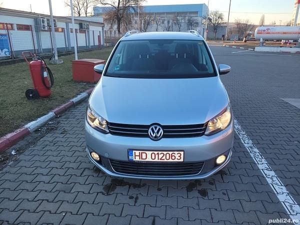 Second-hand VW Touran Highline 105 CP (77 kW) 2011 Argintiu Monovolum