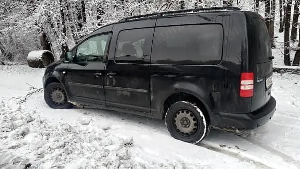 Second-hand VW Caddy Maxi 105 CP (77 kW) 2012 Negru Monovolum