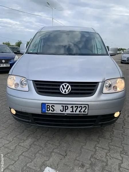 Second-hand VW Caddy Maxi Life 105 CP (77 kW) 2010 Argintiu Monovolum
