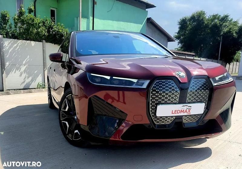 Culoarerosu Utilizat 2024 BMW iX Comfort Edition SUV | 76.472 EUR (Preț OK) - Imagine 1/4