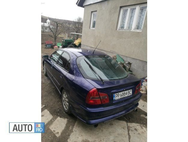 Second-hand Mitsubishi Carisma 115 CP (84 kW) 2004 Albastru Hatchback