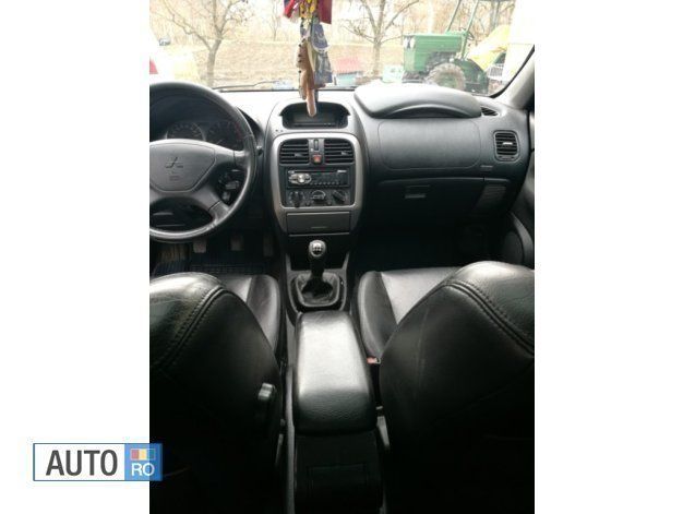 Second-hand Mitsubishi Carisma 115 CP (84 kW) 2004 Albastru Hatchback