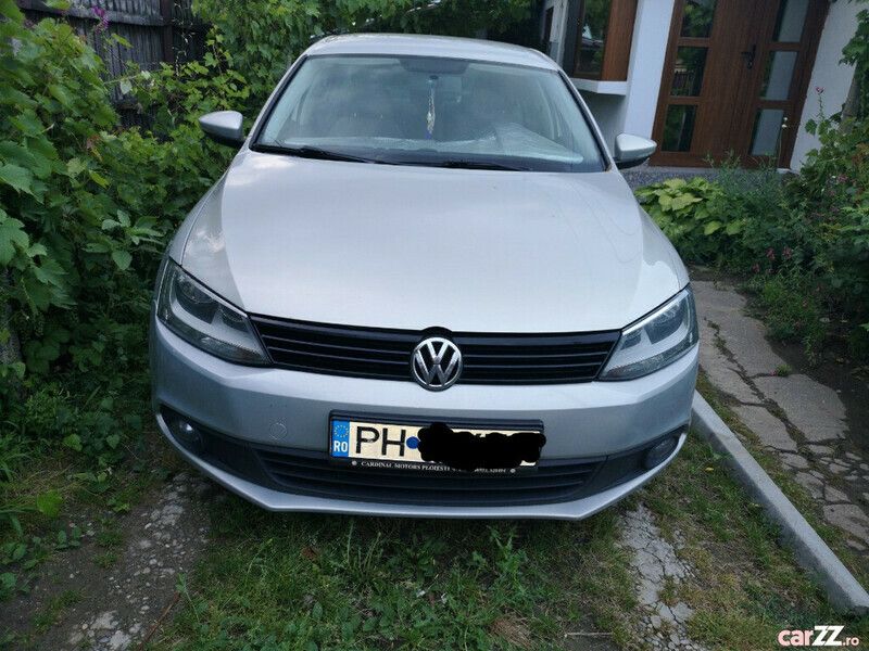 Second-hand VW Jetta 105 CP (77 kW) 2011 Argintiu Berlinǎ
