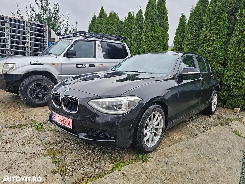 Culoarenegru Utilizat 2014 BMW 116 Hatchback | 6.500 EUR (Preț bun) - Imagine 1/4