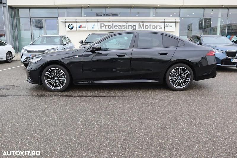 Culoarenegru Utilizat 2025 BMW 520 Berlinǎ | 55.539 EUR - Imagine 1/4