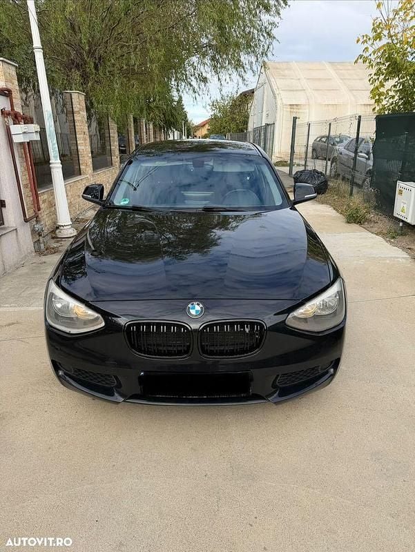 Culoarenegru Utilizat 2011 BMW 116 Sport Line Hatchback | 7.099 EUR (Preț OK) - Imagine 1/4