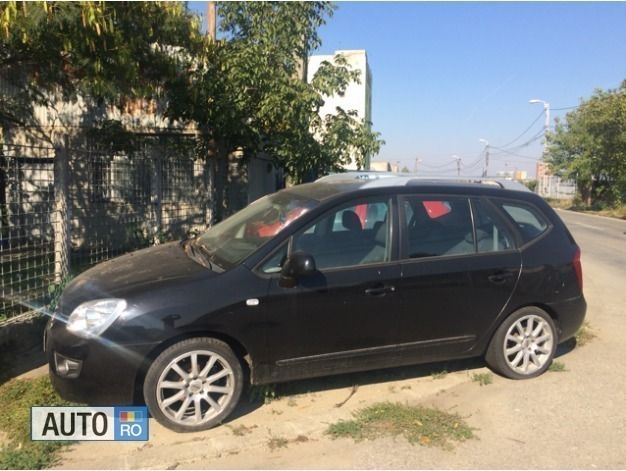 Second-hand Kia Carens 115 CP (84 kW) 2011 Negru Monovolum