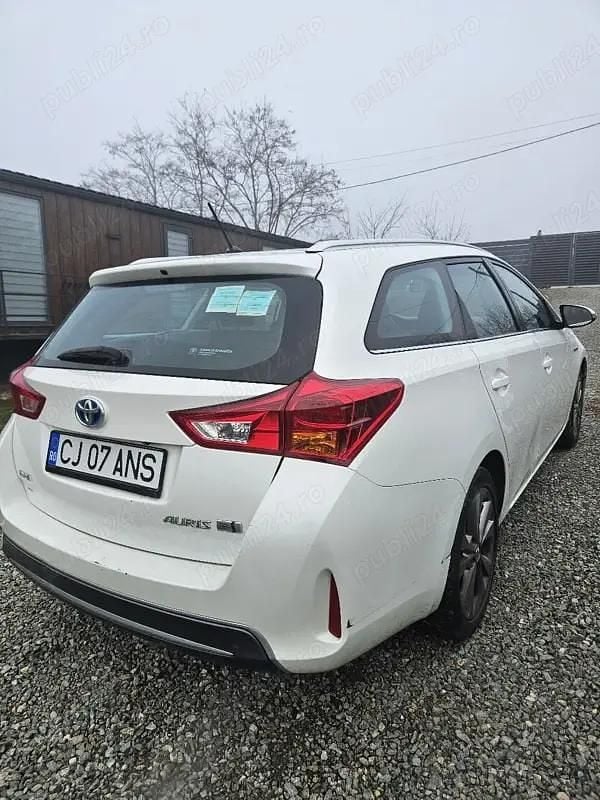 Second-hand Toyota Auris Hybrid 98 CP (72 kW) 2013 Break