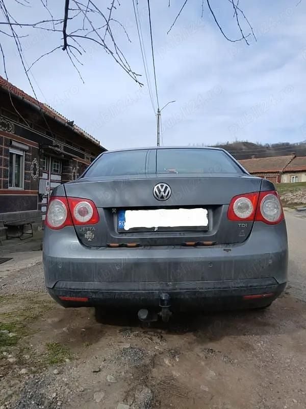 Second-hand VW Jetta 105 CP (77 kW) 2009 Gri Berlinǎ