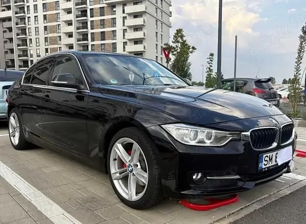 Negru Utilizat 2014 BMW 320 Comfort Edition Berlinǎ | 12.500 EUR (Preț bun) - Imagine 1/4