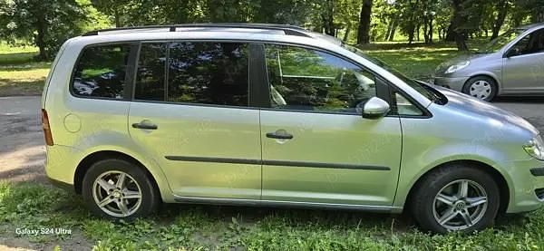 Second-hand VW Touran 104 CP (76 kW) 2010 Argintiu Monovolum