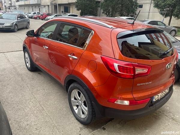Second-hand Kia Sportage 184 CP (135 kW) 2013 Portocaliu SUV