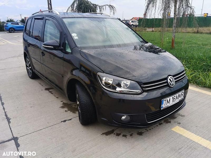 Culoarenegru Utilizat 2014 VW Touran Highline Monovolum | 7.200 EUR (Preț bun) - Imagine 1/4