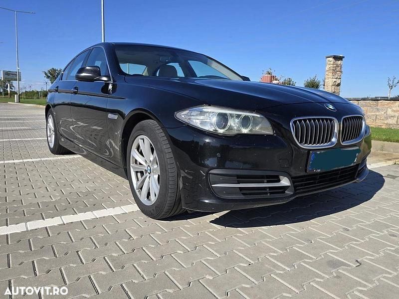 Culoarenegru Utilizat 2014 BMW 520 Berlinǎ | 10.900 EUR (Preț bun) - Imagine 1/4