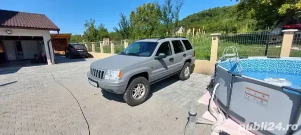 Gri Utilizat 2003 Jeep Grand Cherokee SUV | 5.950 EUR - Imagine 1/4