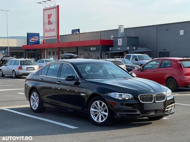 Second-hand BMW 520 Comfort Edition 184 CP (135 kW) 2014 Negru Berlinǎ