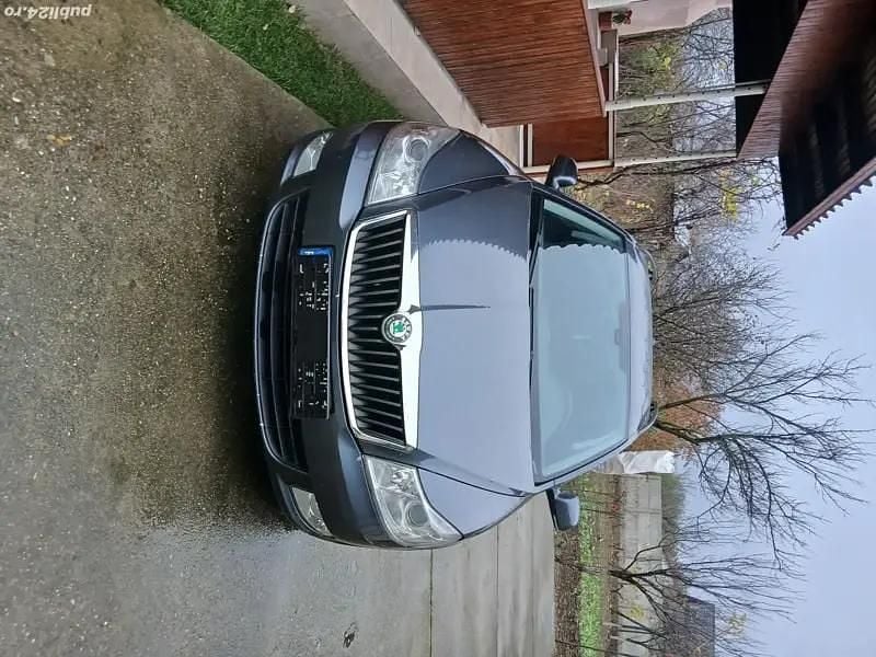 Gri Second-hand 2010 Skoda Octavia Break | 4.300 EUR (Preț OK) - Imagine 1/4