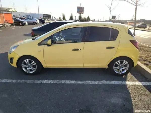 Second-hand Opel Corsa 88 CP (64 kW) 2012 Galben Berlinǎ