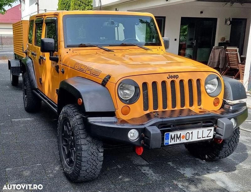 Portocaliu Utilizat 2013 Jeep Wrangler Unlimited SUV | 24.200 EUR - Imagine 1/4